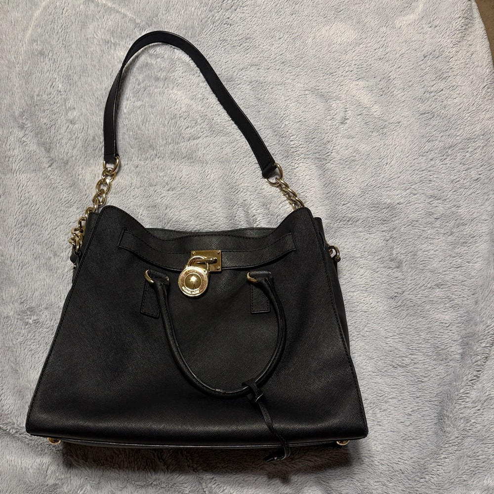 Michael Kors Black Tote with Gold Accents comes with dust bag